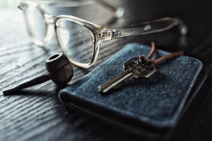 a pipe and a wallet on the table